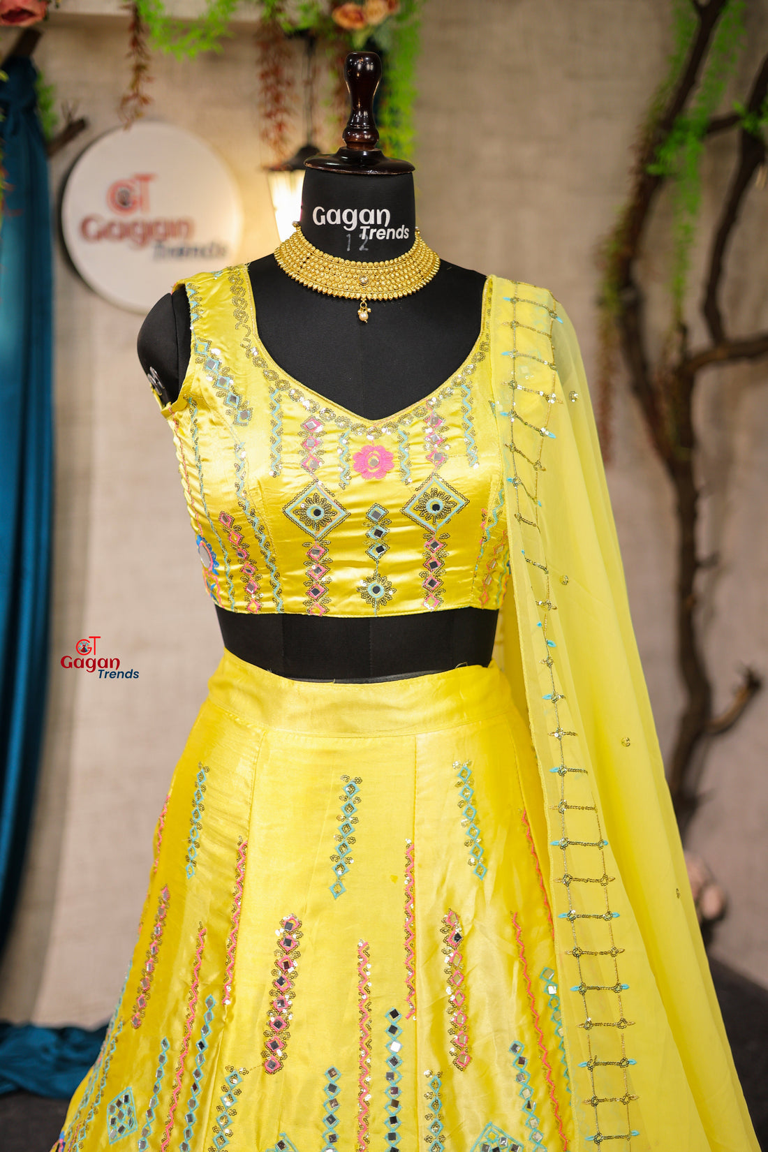 Yellow Japan Satin Silk lehenga with delicate mirror work and designer blouse perfect match for you